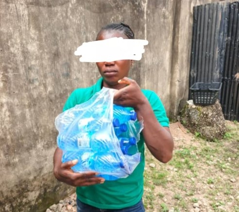 Woman Caught Smuggling Alcohol Disguised as Bottled Water to Inmate in Ogun State